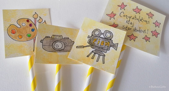 Cake flags showing varoius photo, film and art materials