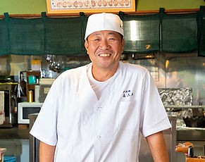 A Michelin-starred restaurant in Osaka's Minato Ward, specializing in premium wild-caught pufferfish (fugu) dishes, served in an elegant Japanese setting.