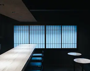 A discreet upstairs bar in Shinsaibashi featuring minimalist design, dim lighting, and carefully crafted cocktails.