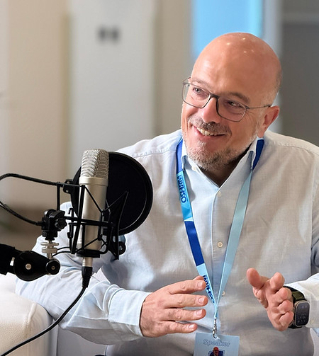 A picture of Julian Troian recording a Podcast