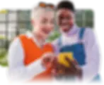 two women using phone to update their session schedule