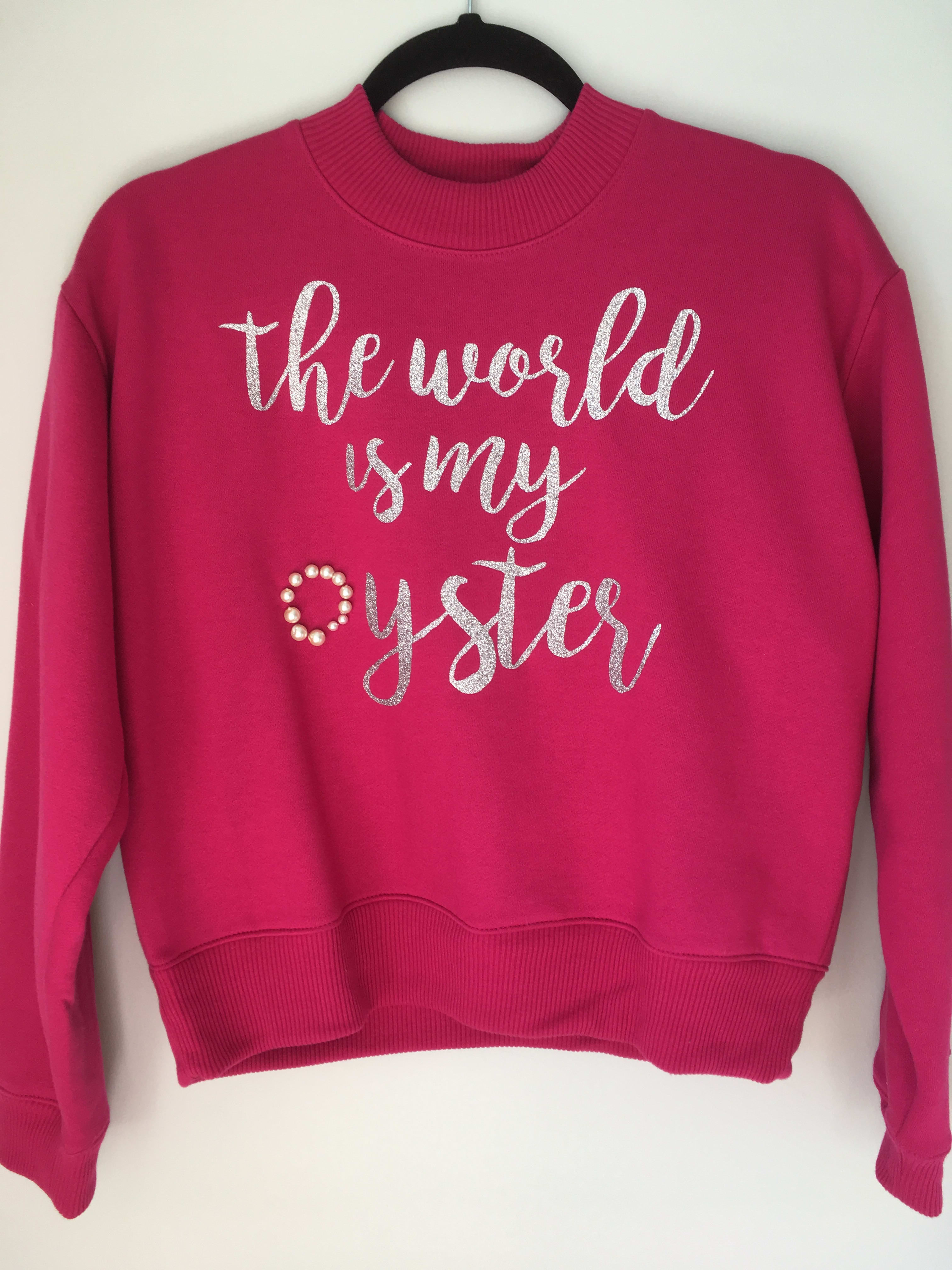 The World is My Oyster pink sweatshirt