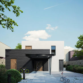 Maison proche du littoral avec extension discrète sur l'arrière, illustrant un simple agrandissement conforme à la loi Littoral.