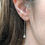 Thumbnail: ear stack . silver pearl dangly earrings