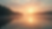 Eye-level view of a quiet sunrise over a peaceful lake with soft morning light