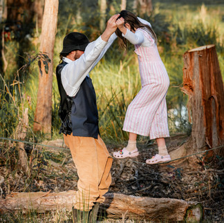 Child walking the tightrope with dad wedding in nature Pillar Valley Grafton
