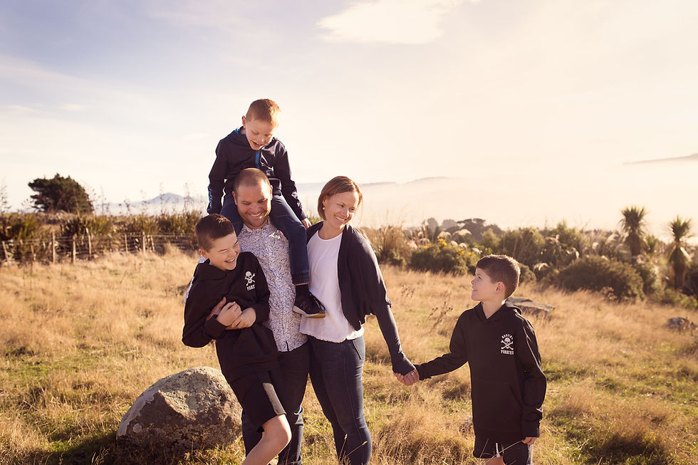 Family portrait in a distinctly New Zealand setting in Dunedin