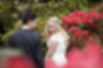 Bride and groom share a quiet moment after their wedding ceremony at the Rhododendron Dell in Port Chalmers