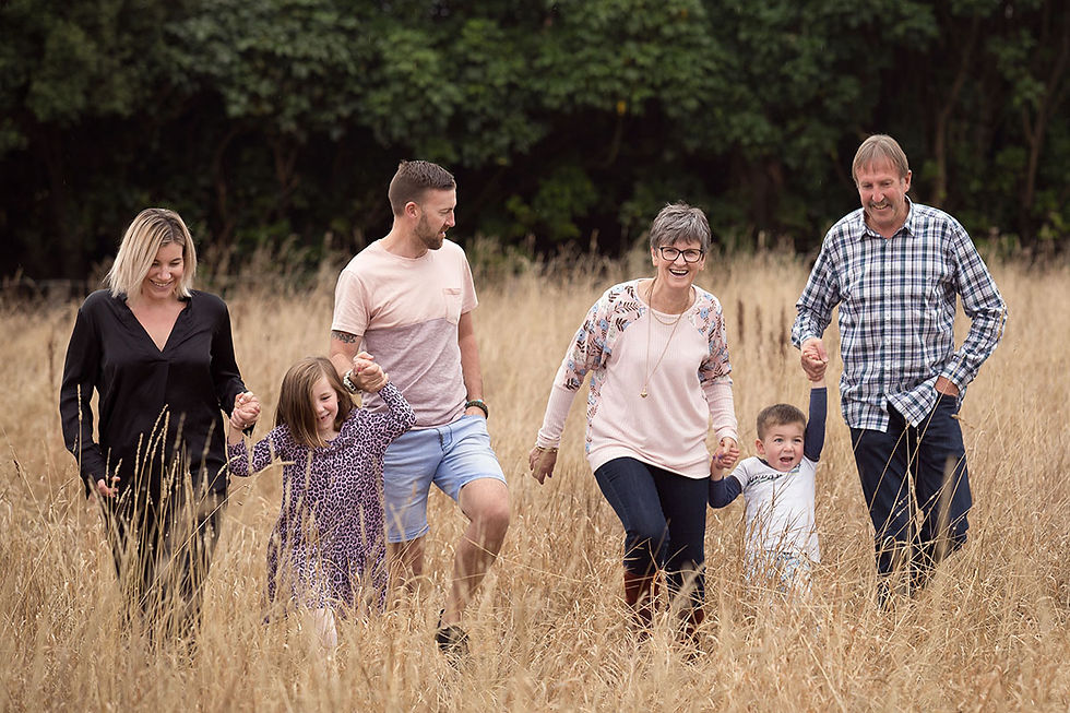 Family portrait shot in long grass at a location in Mosgiel, Dunedin, NZ