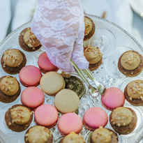 Hand picking sweets from a plate