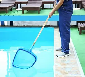 depositphotos_221072384-stock-photo-male-worker-cleaning-outdoor-pool.jpg