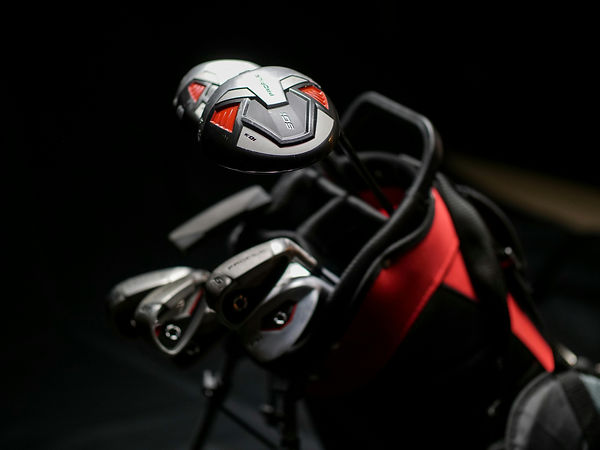 detailed view of golf clubs in golf bag