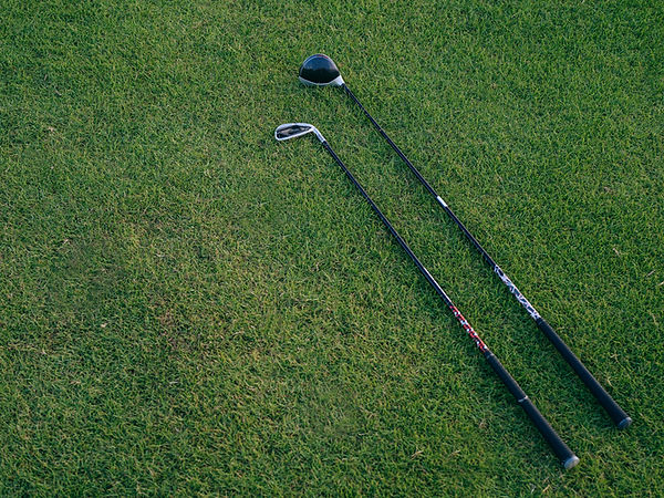 golf clubs on grass