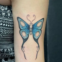 Tattoo of a blue butterfly