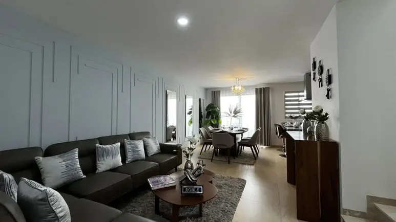 Sala de la Casa Modelo Roble en Los Robles Ziré.