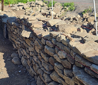 Dry lay stone retaining wall in South Frontenanc, Ontario