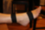 foot with black athletic tape