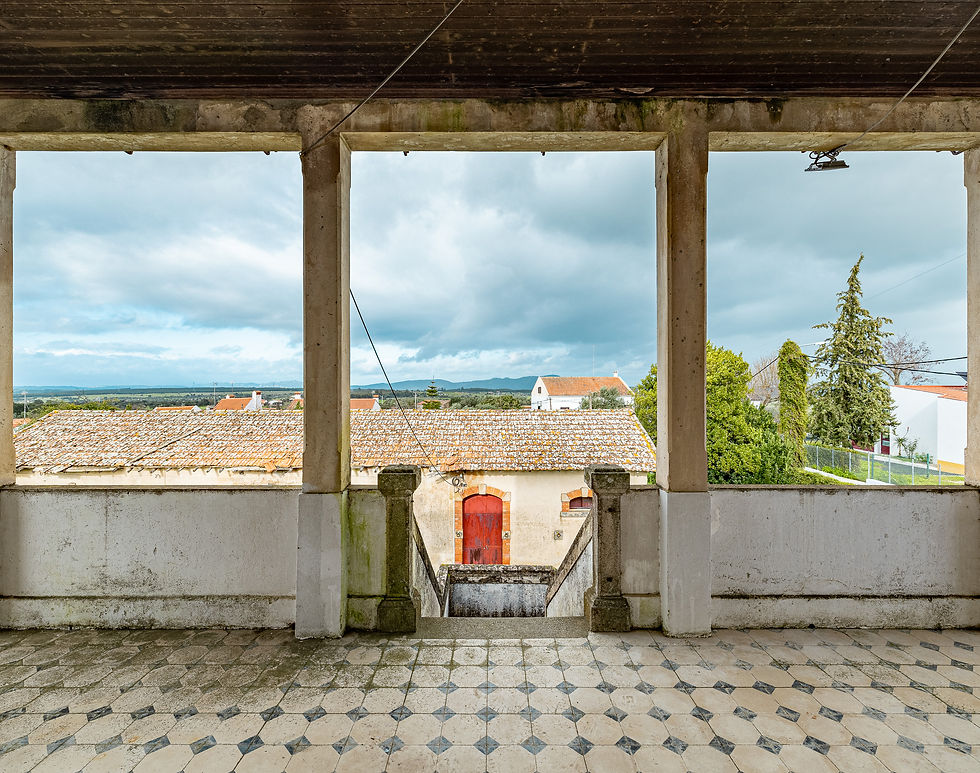 Covered veranda with columns looking over the rooftops of Nisa and the Alentejo plain