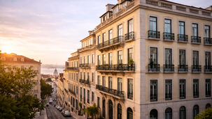 Lisbon residential building in natural light illustrating property ownership and annual property taxes in Portugal