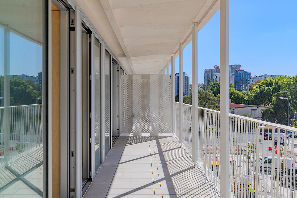 Balcony at Santos Dumont 46 with white metal railings and views over Lisbon