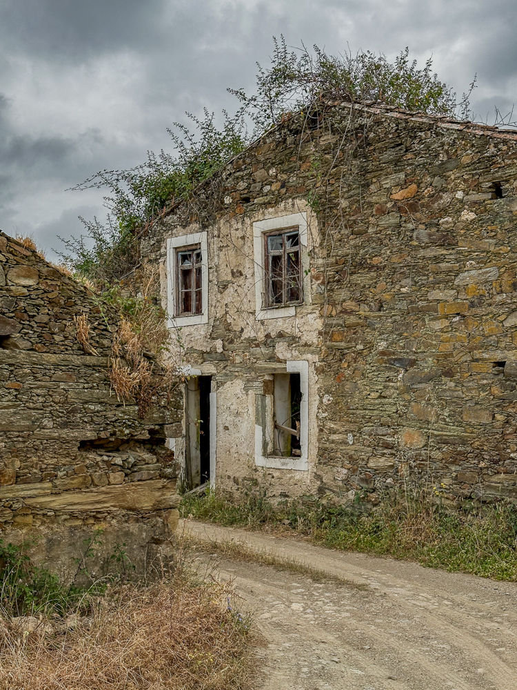 Ruined schist house in the abandoned village of Azinheira, Portugal