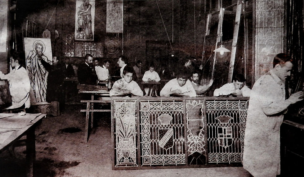 Historic photograph of craftsmen inside a Maumejean stained-glass workshop