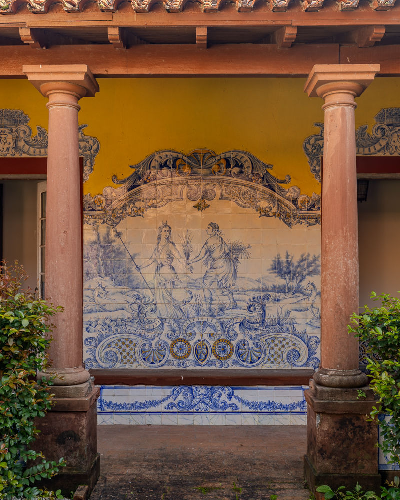 Blue-and-white azulejo panel with a garden scene in the courtyard gallery, Quinta do Casainho