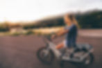 Woman riding an ebike on a test ride.