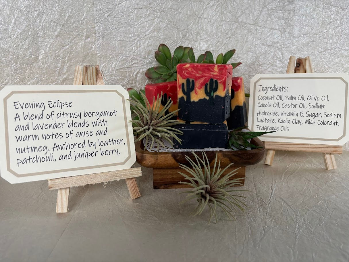 Evening Eclipse product with desert motif, flanked by description and ingredient easels
