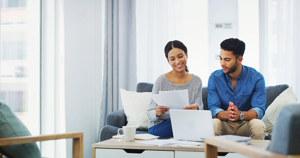 documents-laptop-portfolio-with-couple-sofa-home-living-room-bank-payment-accounting-finan