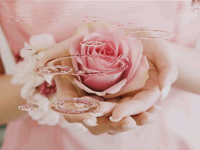 Mão com rosa e pingos.