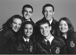 Six smiling NC FFA state officers from the 2000s
