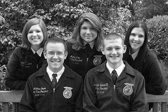 Five smiling NC FFA state officers from the 2000s