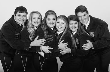 Six smiling NC FFA state officers from the 2010s