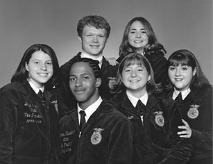 Six NC FFA state officers from the 2000s, smiling in jackets