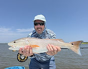 55 - Greg R with Redfish (13 Aug).jpg