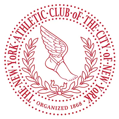 Logo of the NYAC Rugby Club consisting of a winged foot over laurel wreath.