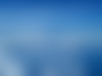 Fluffy white clouds against bright blue sky