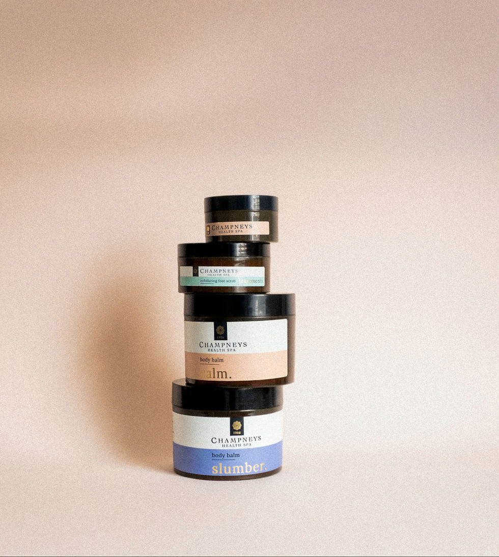 Champneys Health Spa Calm collection Amber jars stacked unevenly featuring calm slumber and treatments mood states