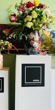 Hand painted vases and original paintings by Merel Feenstra displayed in her studio in Asperen, the Netherlands