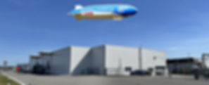 Zeppelin über Maucher-Gebäude: Luftaufnahme