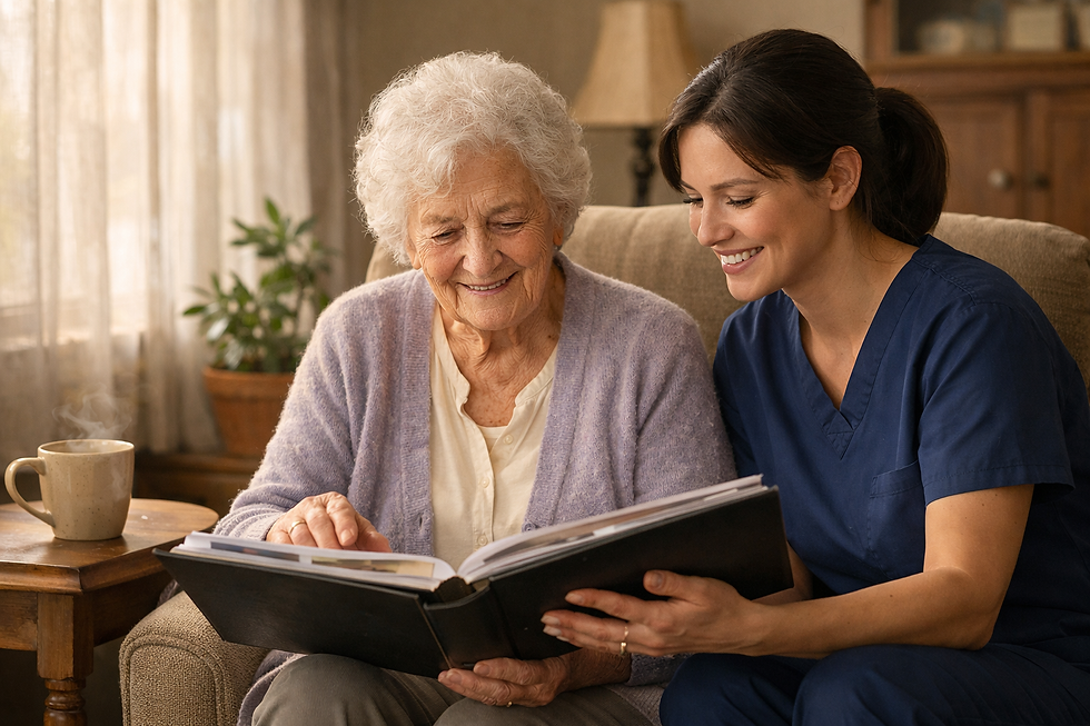 An elderly woman and her caregiver share a warm, joyful moment together as they look through a photo album in a softly sunlit living room.