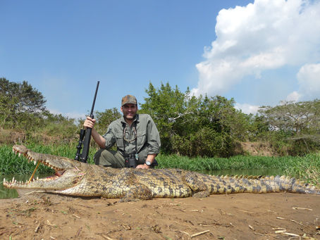 Samir posing with his crocodile harvest