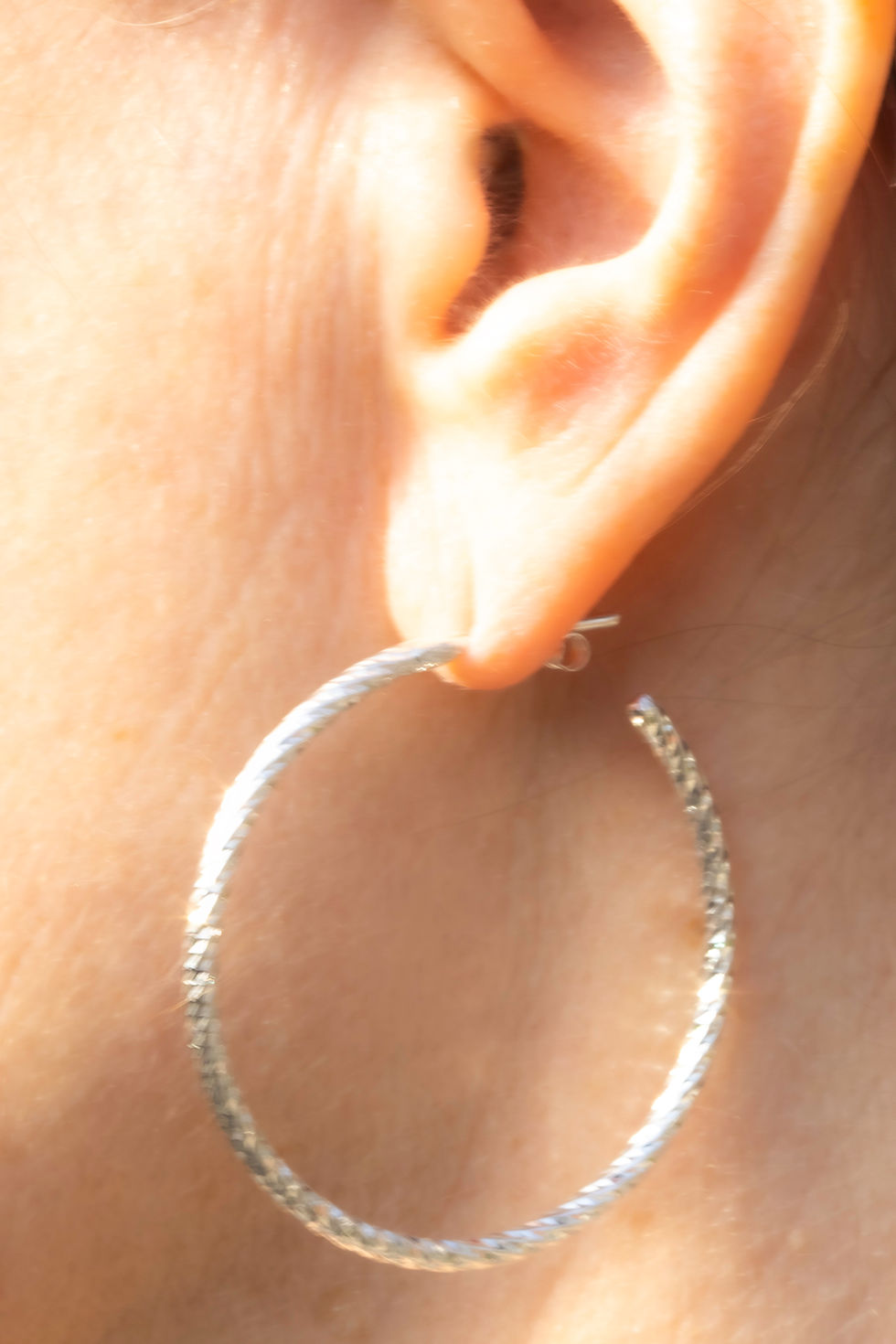 Thumbnail: Saira diamond cut hoop earrings available in 4 sizes