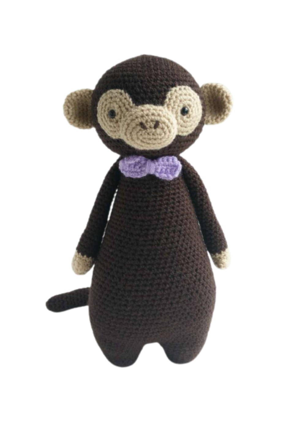 Crochet stuffed monkey toy with bowtie in the colors brown, and purple