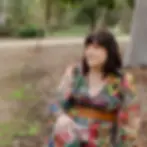 Tricia Branding 26-sitting on a rock.webp