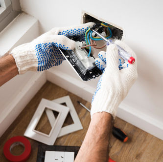 electrician-s-hand-installing-power-socket-home_edited_edited.jpg