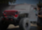 Exterior of a jeep being hand washed.