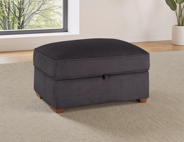 Pouf de rangement gris foncé en tissu, avec pieds en bois.