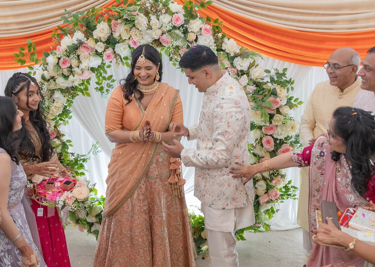 Bride and groom during ceremony at Prested Hall